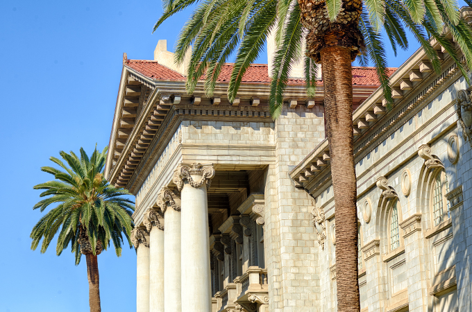 Palm trees frame the facade of the Administration Building.