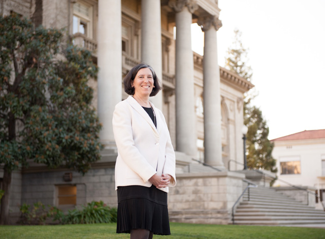 Nancy Wayne in front of Administration Building