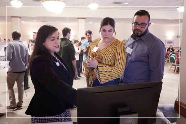 Professionals looking at a computer screen