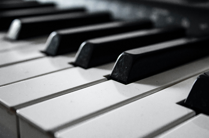 A black and white macro photo of piano keys.