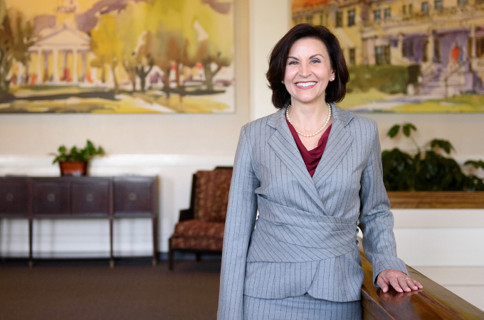 President Newkirk stands on a landing in the Administration Building.