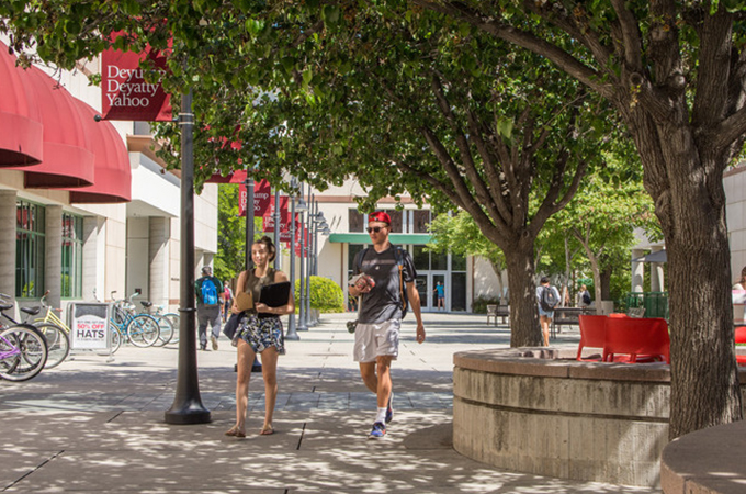 Students walking through Hunsaker Plaza