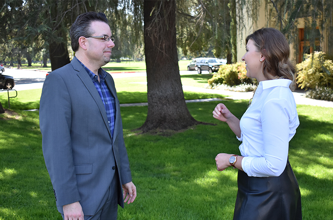 Mentor Thomas LeMasters ‘06 (left) and School of Business student Svetlana Isayeva '18 chat after the opening reception for the Mentorship Program.