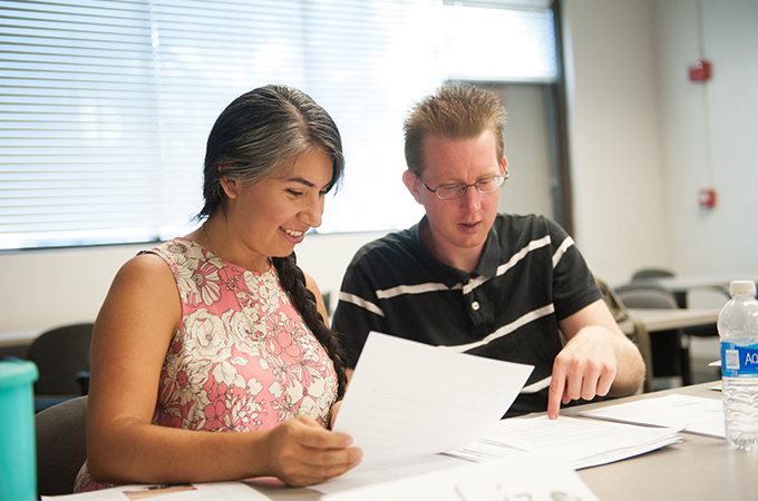 A female and male student studying.