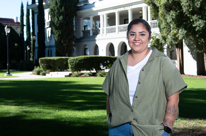 Carla Flamenco stands outside of Grossmont Hall. 