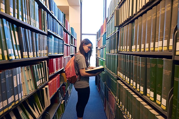 student in library