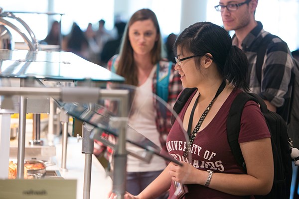 Students in line to receive their food in the Irvine Commons