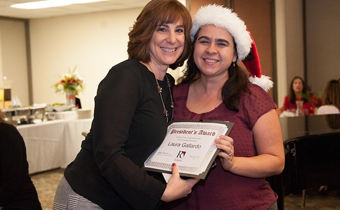 Michelle Rogers giving Laura Gallardo a President's Award