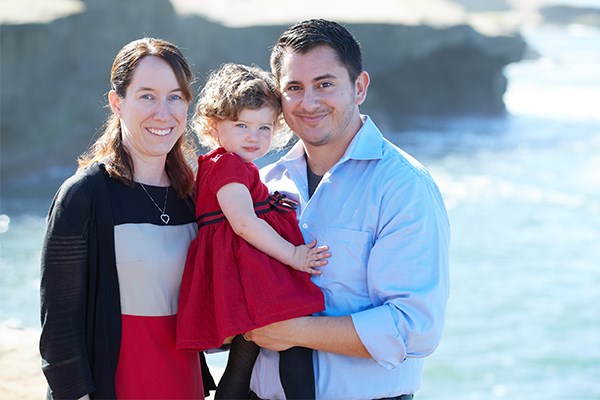 Tim and Jessica Moore Strysko with their child