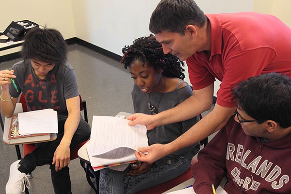 Professor working closely with students