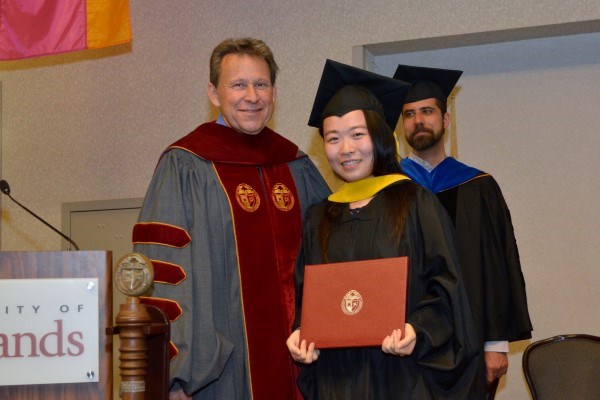 Student with Faculty at valediction