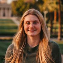 Student standing in front of quad and chapel