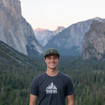 Student standing in front of quad and chapel